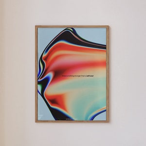 May include: A framed abstract art print with a colorful, swirling design in shades of red, orange, yellow, green, and blue. The text "There is nothing stronger than a soft soul" is printed in black at the bottom of the print.