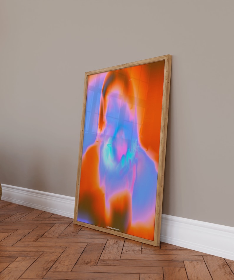 May include: Abstract art print in a wooden frame. The print features a colorful, swirling design in shades of orange, blue, and purple.