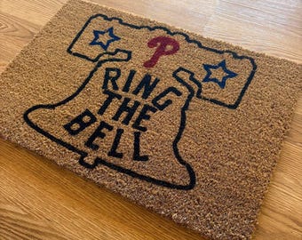 Alfombra de bienvenida "Toca la campana" de los Philadelphia Phillies