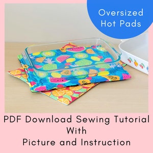 May include: Two oversized hot pads with a tropical fruit print. The hot pads are layered on top of each other and a glass baking dish is sitting on top of them. The text "Oversized Hot Pads" is in blue text on a white background. The text "PDF Download Sewing Tutorial With Picture and Instruction" is in black text on a pink background.
