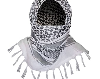 May include: A white and black patterned headscarf with a fringe border. The scarf is folded to create a hood shape.
