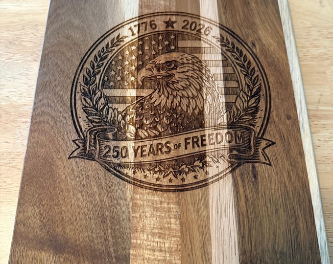Celebrate American heritage with this engraved “250 Years of Freedom” cutting board featuring a detailed eagle and flag, 1776–2026 design.