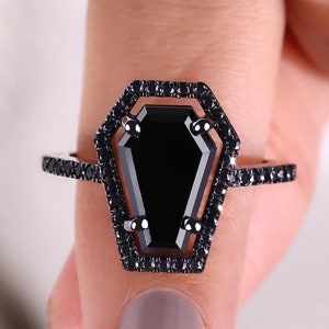 Coffin ring with a bold and contemporary style for a standout look.