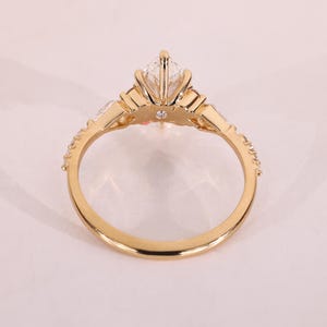 Unique engagement ring with claw prong setting.