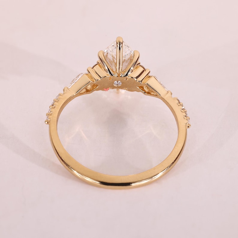 Unique engagement ring with claw prong setting.
