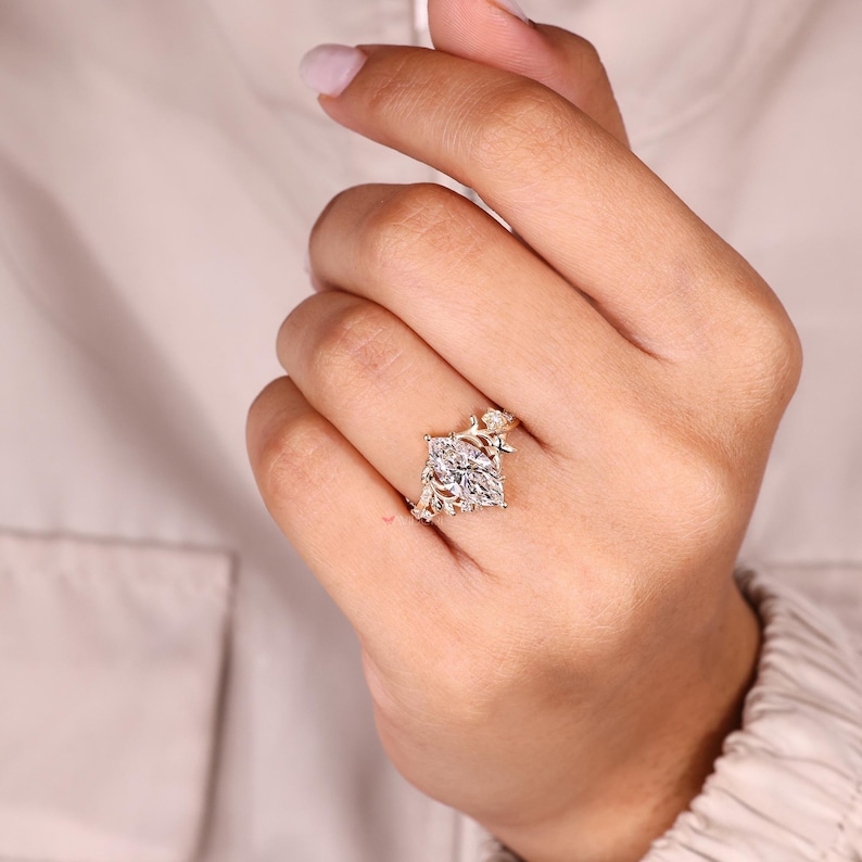 Handmade marquise diamond ring with claw prongs.