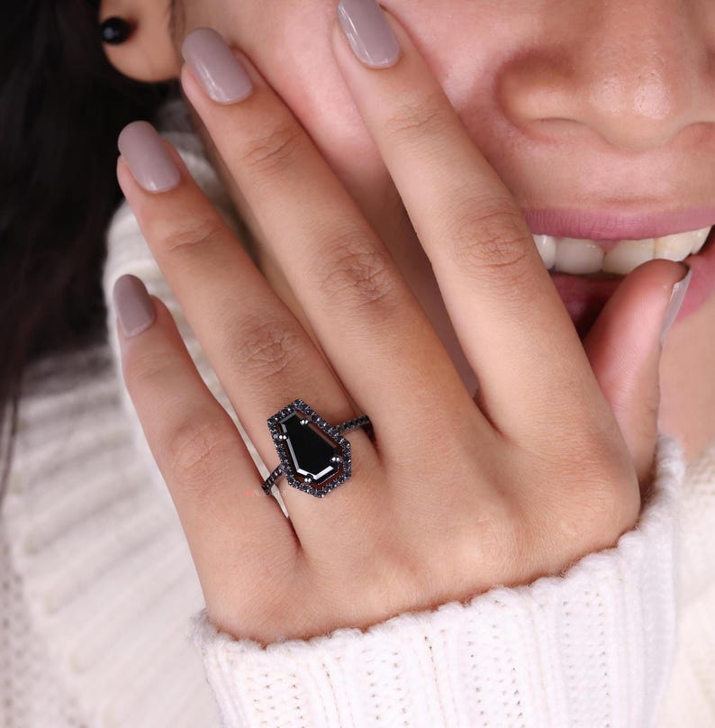 Coffin cut ring featuring a unique design and striking elegance.