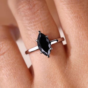 Avideri ring with marquise moissanite for a luxurious, timeless design.