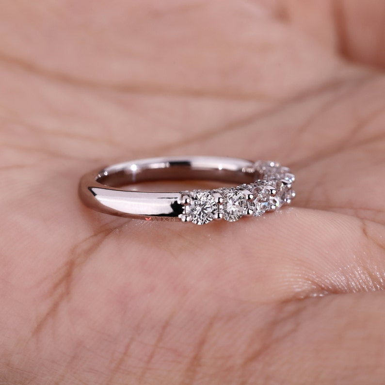 Side view of the eco-friendly diamond wedding band, displaying the white gold band's sleek and polished finish. The seamless craftsmanship ensures a comfortable fit, making it suitable for daily wear and special