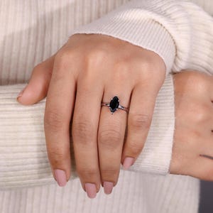 Unique marquise moissanite ring set in a high-quality white gold band.