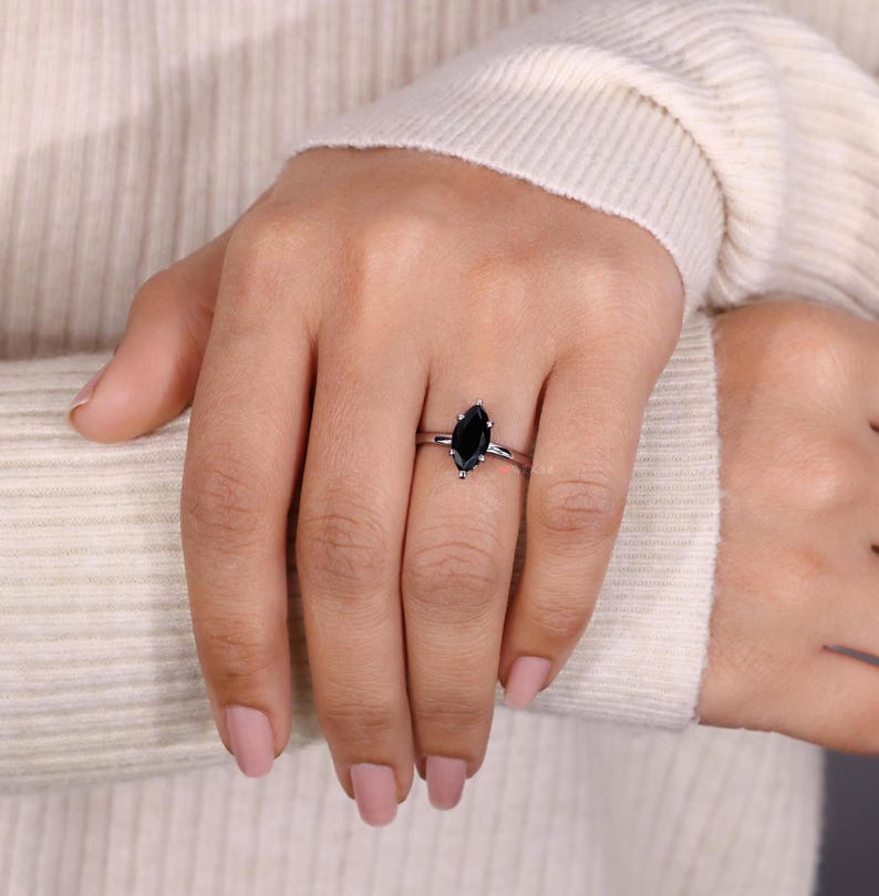 Unique marquise moissanite ring set in a high-quality white gold band.