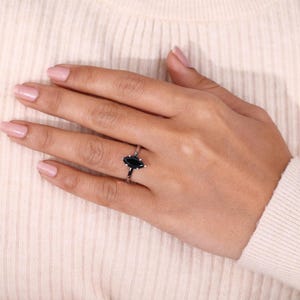 Unique moissanite engagement ring with a marquise cut for elegant sparkle.