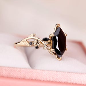 Nature inspired engagement ring with leaf style prong design.