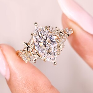Cathedral style marquise diamond ring design.
