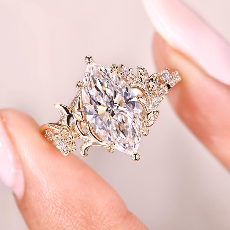 Cathedral style marquise diamond ring design.