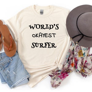 Worlds okayest surfer Tee surfing shirt beach vacation gift adventure tshirt for surfers birthday tee unisex