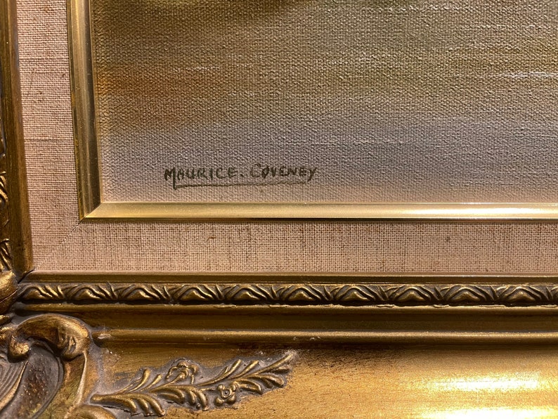 May include: Close-up of the signature "Maurice Couvney" on a framed painting. The signature is in black ink on a canvas with a beige background.