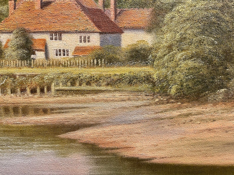 May include: A painting of a quaint cottage with a brown roof and white walls, nestled beside a river. The cottage has a small garden with a white picket fence. The river is calm and reflects the sky and trees. The painting is done in a realistic style with soft brushstrokes.