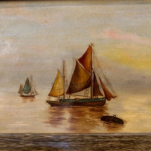 May include: A painting of three sailboats on a calm sea with a light blue sky and a yellow sunset in the background.