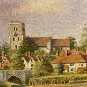 May include: A painting depicting a quaint English village with a church tower, houses, and a stone bridge. The scene is bathed in soft, warm light, creating a peaceful and idyllic atmosphere.