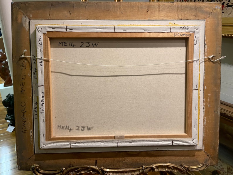 May include: The back of a framed painting with the text "ME14 2JW" written on it. The frame is made of wood and has a gold finish.