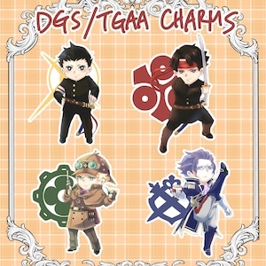 May include: Four illustrated character charms featuring anime-style characters with different colored outfits and accessories. The characters are standing in front of a background with a grid pattern. The text "DGS/TGAA CHARMS" is at the top of the image.