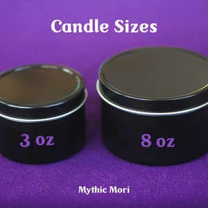 May include: Two black metal candle tins, one labelled "3 oz" and the other labelled "8 oz". The tins are on a purple surface. Candle Sizes.