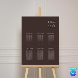 Puede incluir: Un cartel rectangular de color marrón oscuro para la distribución de mesas sobre un caballete de madera. El cartel muestra el texto FIND SEAT en la parte superior derecha, seguido de seis columnas etiquetadas de TABLE ONE a TABLE SIX.