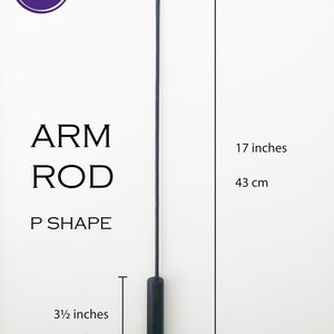 May include: Black arm rod for puppetry, measuring 17 inches long and 3 1/2 inches wide. The rod is made of metal and has a P shape at the end.  ARM ROD P SHAPE.