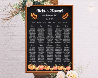 May include: A chalkboard wedding seating chart with a rustic wooden frame. The chart is decorated with fall leaves and pumpkins. The text on the chart reads "Nicki & Stewart" and "4th November 2022".
