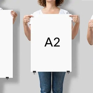 May include: Three people holding up white paper sheets with the letters A1, A2, and A3 printed on them.