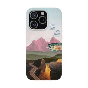 May include: A smartphone case featuring a surreal collage of pink mountains, a winding road, and a fish with a cigarette in its mouth. The text reads: WHEN LIFE GIVES YOU A LEMON YOU MUST EAT THE LEMON ALL OF IT INCLUDING THE PEEL.