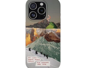 May include: A smartphone case featuring a surreal collage of a green frog smoking, rocky mountain peaks, and skiers on a snowy slope. The text at the bottom reads: AT LAST SOME GOOD NEWS THE BANANAS ARE RIPE. The design uses muted earth tones.