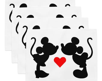 May include: A set of four rectangular white placemats, each featuring a black silhouette of two cartoon mice facing each other with a bright red heart positioned between them. The design is centered on each placemat, showing the mice in profile.