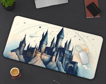 May include: A white and blue mouse pad with a detailed illustration of a castle with a dark blue and gray color scheme. The castle is surrounded by a starry sky and a planet.