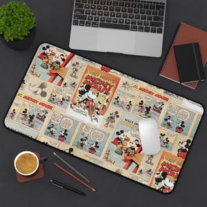 May include: A rectangular mouse pad featuring a vintage comic strip design with Mickey Mouse illustrations. The pad has a black border and includes the text "WALT DISNEY'S MICKEY MOUSE" and "MICKEY'S NIGHTMARE". A computer mouse rests on the pad.