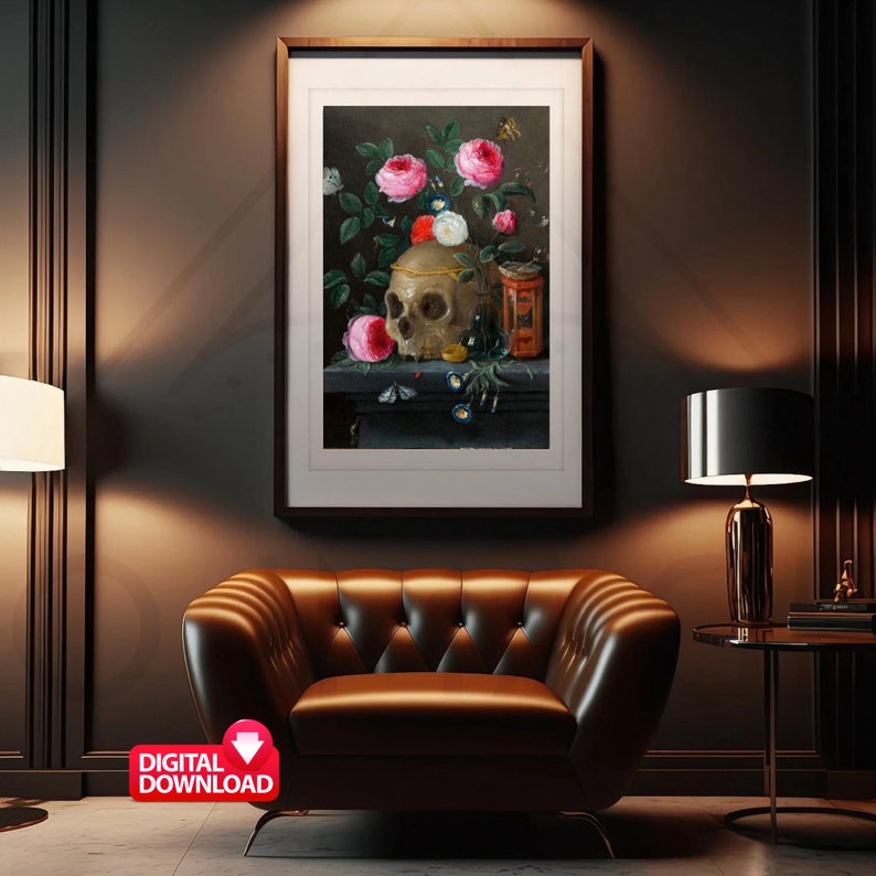 May include: A framed still life painting featuring a skull adorned with a gold band, surrounded by pink and white roses. A small orange container and butterflies are also present. The artwork is displayed above a brown leather armchair.