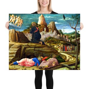 May include: A painting depicting a scene from the Bible, the Agony in the Garden. Jesus kneels in prayer on a rocky hilltop, while three of his disciples sleep below. A city is visible in the background, and angels are seen in the sky above.