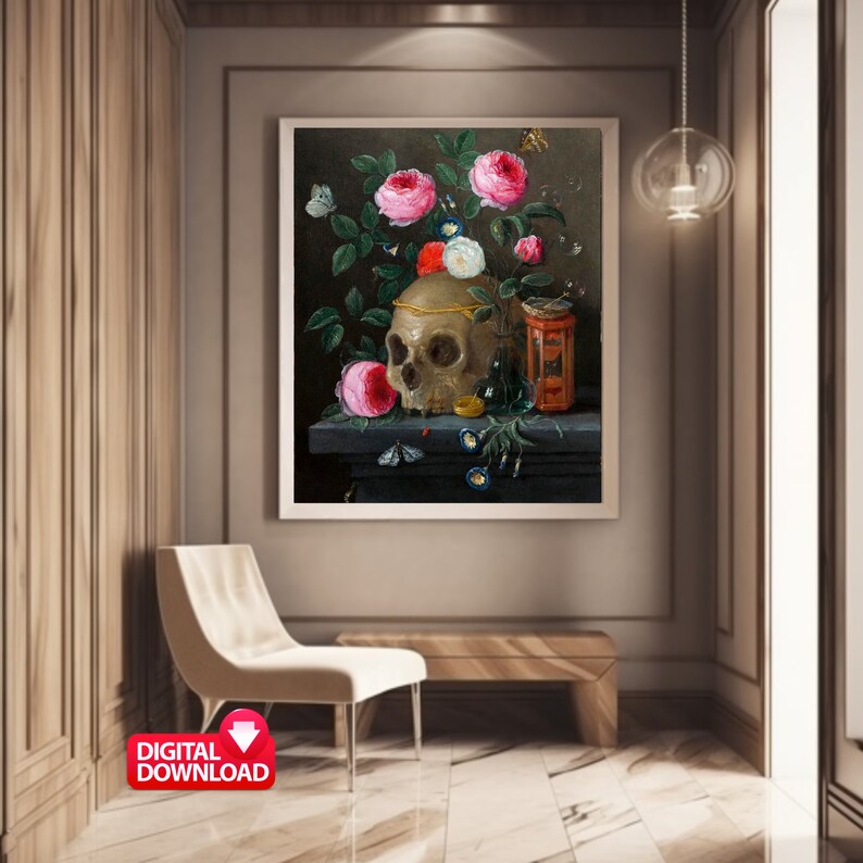 May include: A framed digital download of a still life painting featuring a skull adorned with a gold crown, surrounded by pink and white roses, butterflies, and a small red and gold container. The artwork is displayed in a modern interior setting.