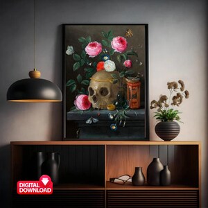 May include: A framed digital download of a still life painting featuring a skull adorned with a gold crown, surrounded by pink and white roses, butterflies, and other decorative elements. The artwork is displayed on a dark surface.