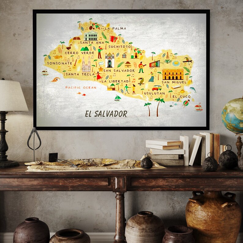 May include: A colorful illustrated map of El Salvador with the names of major cities and towns, including San Salvador, Santa Ana, and La Libertad. The map is on a yellow background with a silver border.