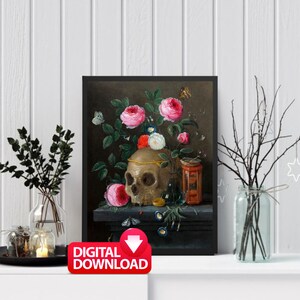 May include: A framed digital download print featuring a still life with a skull, pink roses, butterflies, and a small decorative jar. The skull is adorned with a gold band. The print has a dark background and is displayed on a white shelf.