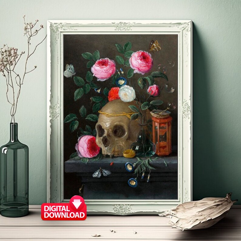 May include: A framed still life painting featuring a skull adorned with a gold crown, surrounded by pink and white roses, butterflies, and other floral elements. The artwork is set against a dark background, with a digital download icon in the corner.