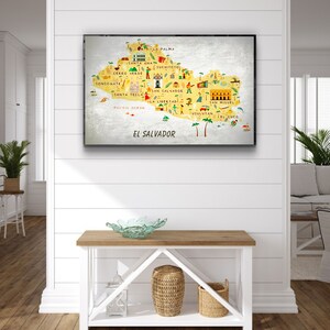 May include: A colorful illustrated map of El Salvador with the names of the major cities and towns labeled. The map is on a white background with a silver metallic border.