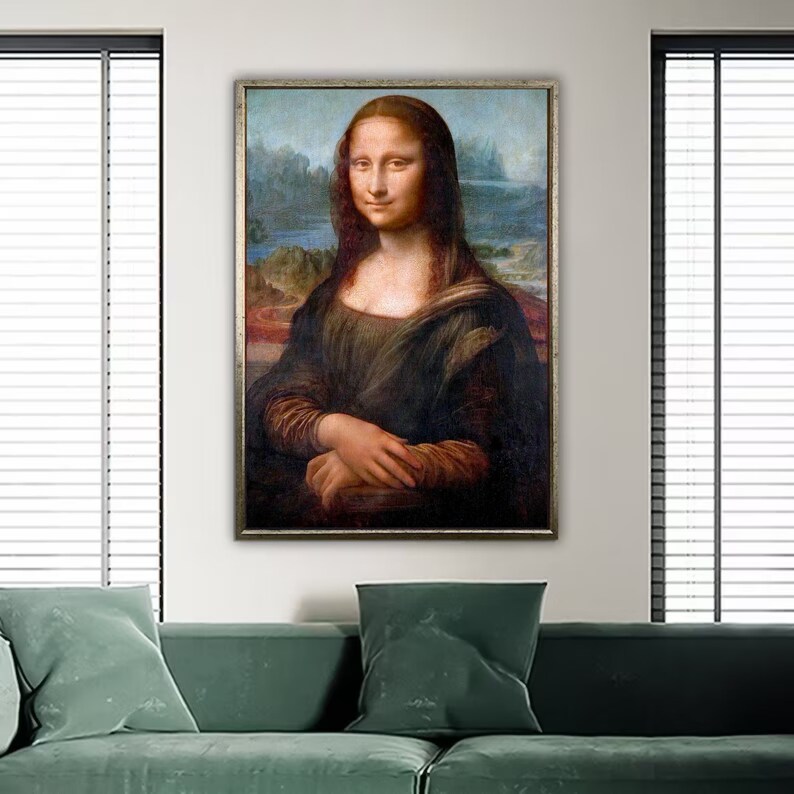 May include: A framed painting of the Mona Lisa, a famous portrait by Leonardo da Vinci. The painting depicts a woman with a soft smile, wearing a dark dress and a light background.