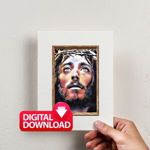 May include: A digital download of a painting depicting a close-up of Jesus Christ's face. He is wearing a crown of thorns and looking upwards. The painting is in a wooden frame.