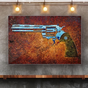 May include: A blue revolver with a black handle on a rusty orange and brown background.