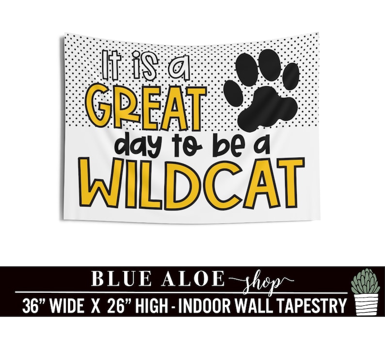 May include: White tapestry with black polka dots and a black paw print. The text "It is a GREAT day to be a WILDCAT" is in yellow letters. The tapestry is 36 inches wide and 26 inches high.