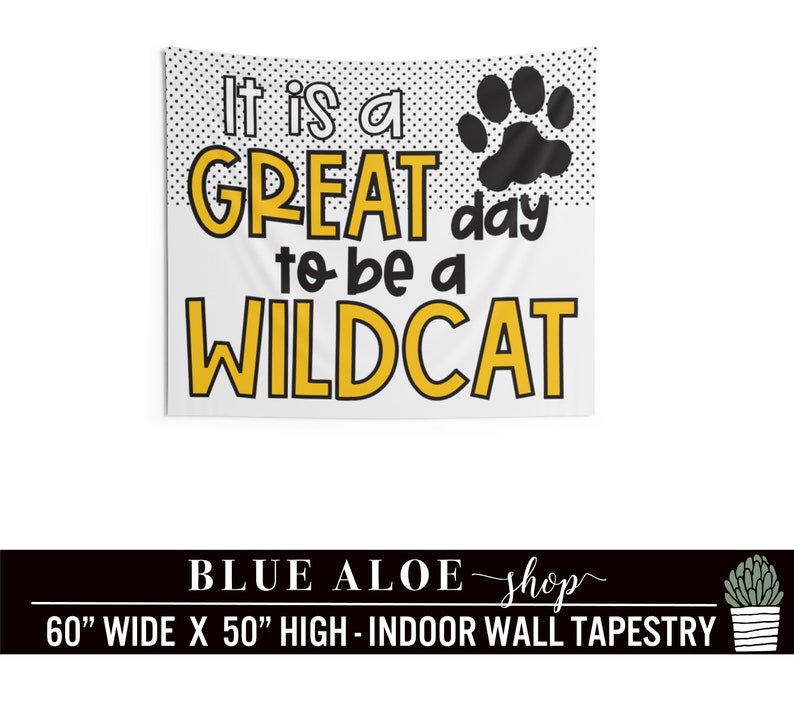 May include: A white tapestry with black polka dots and a black paw print. The text "It is a GREAT day to be a WILDCAT" is in yellow and black letters. The tapestry is 60 inches wide and 50 inches high.