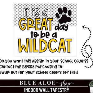 May include: A yellow and black wall tapestry with the text "It is a GREAT day to be a WILDCAT". The tapestry also features a black paw print and a dotted arrow.
